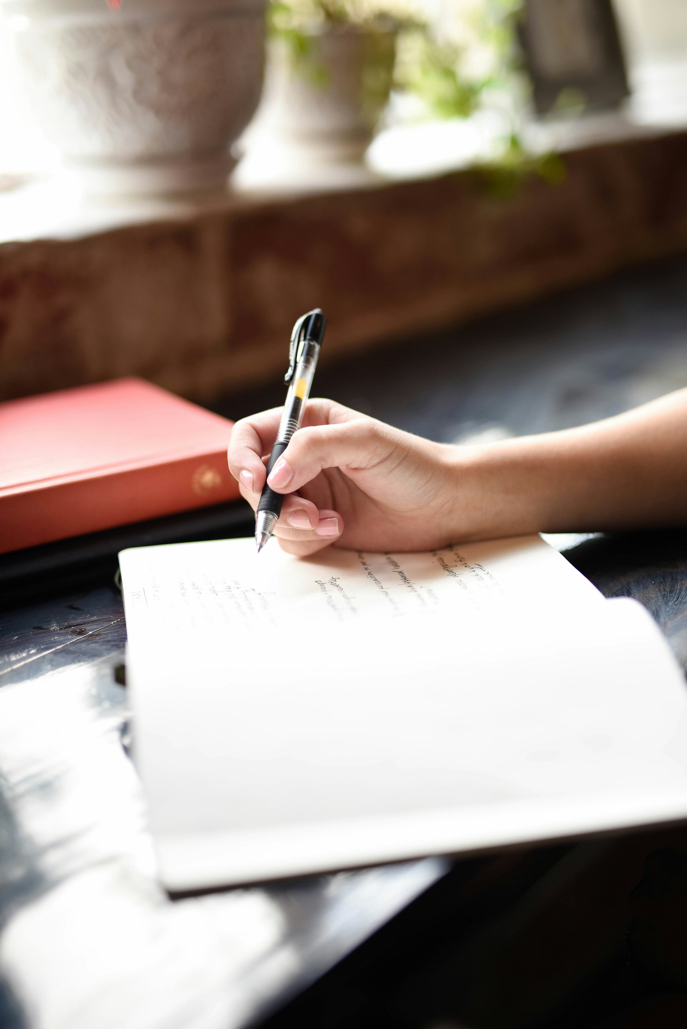 Person writing in a notebook